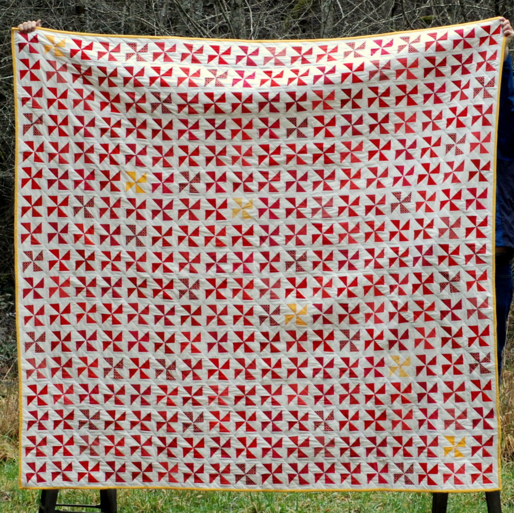 Red Pinwheel Quilt by PiecedTogether Quilts